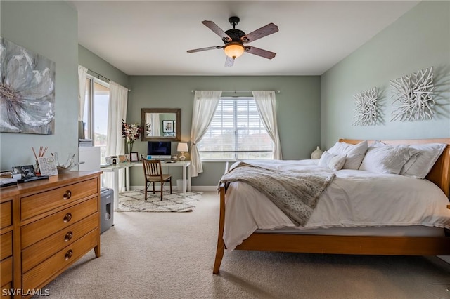 bedroom with light colored carpet and ceiling fan