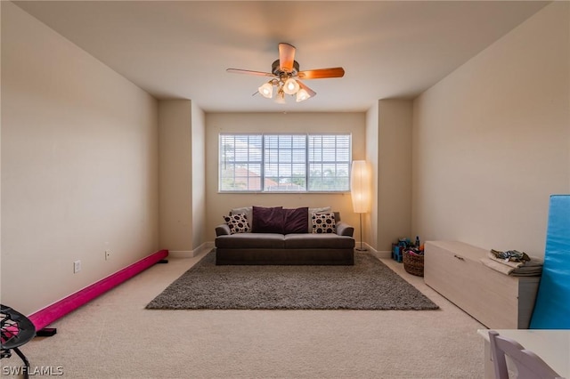 interior space with carpet floors and ceiling fan