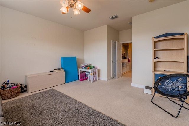 game room featuring ceiling fan and light carpet