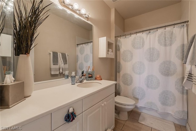 bathroom featuring vanity, tile patterned floors, toilet, and a shower with shower curtain