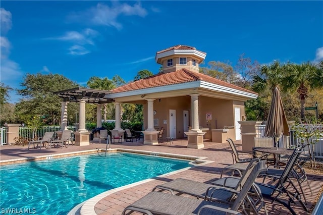 view of swimming pool featuring a pergola and a patio area