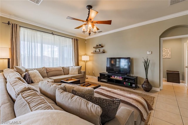 living room with crown molding, ceiling fan, and light tile patterned floors