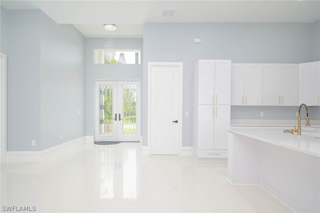 3211 12th St W, Lehigh Acres, FL 33971 - dining room with french doors, visible vents, and light tile patterned floors