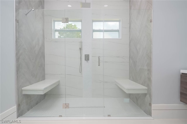 bathroom with tile patterned floors and a shower with door