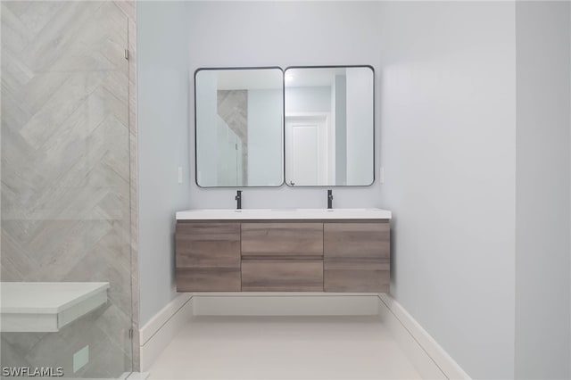 bathroom with double vanity and tile patterned flooring