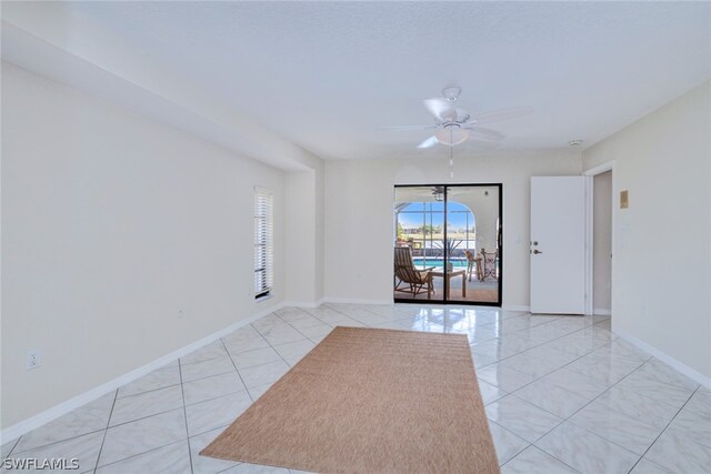 spare room with ceiling fan