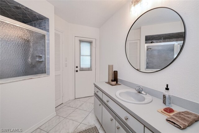 bathroom with vanity and tile patterned flooring