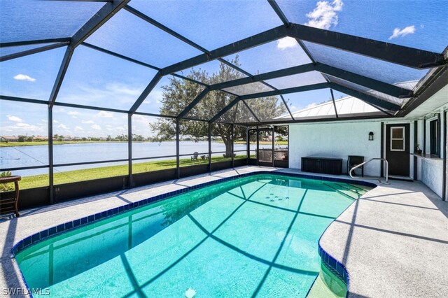 view of swimming pool featuring a water view and a lanai