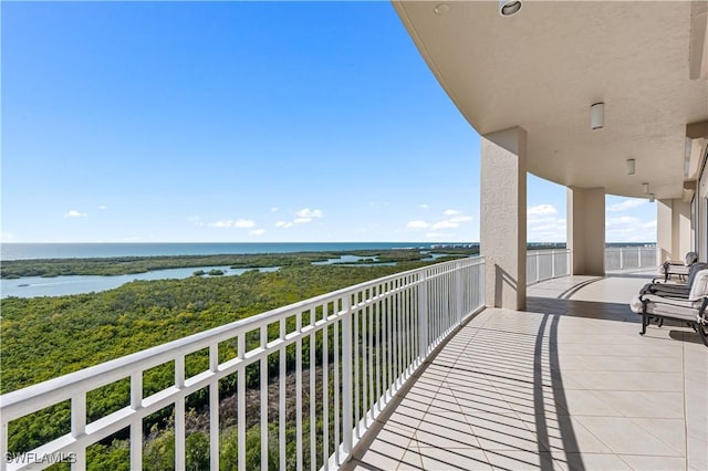 balcony featuring a water view