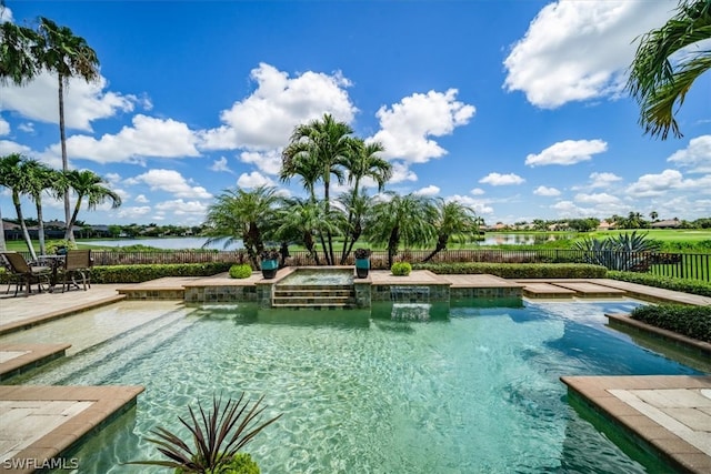 view of swimming pool with pool water feature and a patio area