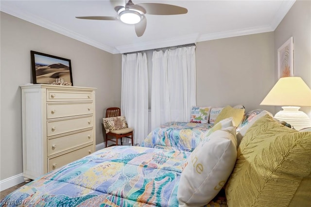 bedroom featuring ceiling fan, ornamental molding, and hardwood / wood-style floors