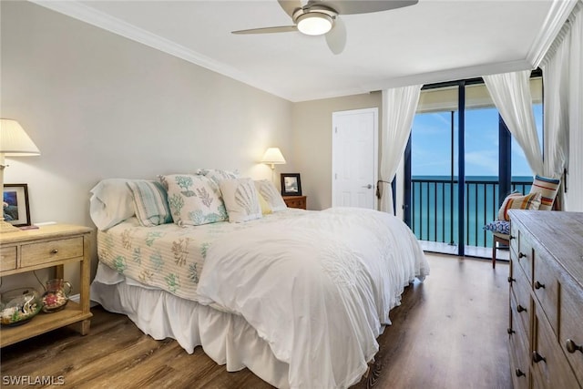 bedroom with access to outside, ornamental molding, dark hardwood / wood-style floors, and a water view