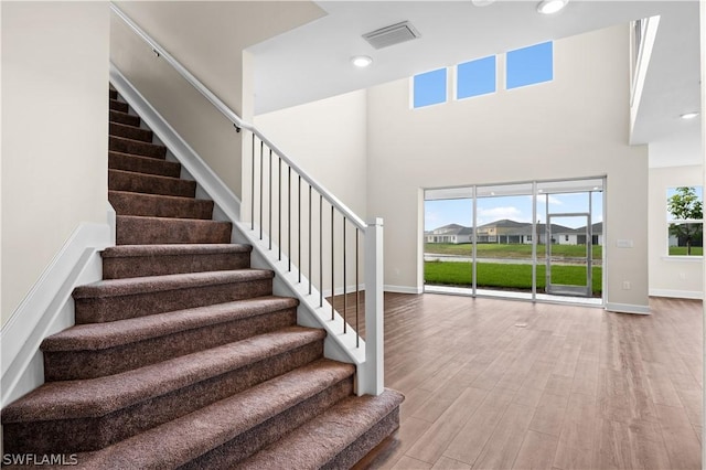 stairs featuring wood-type flooring