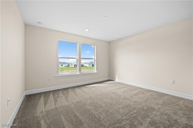 unfurnished room featuring carpet floors