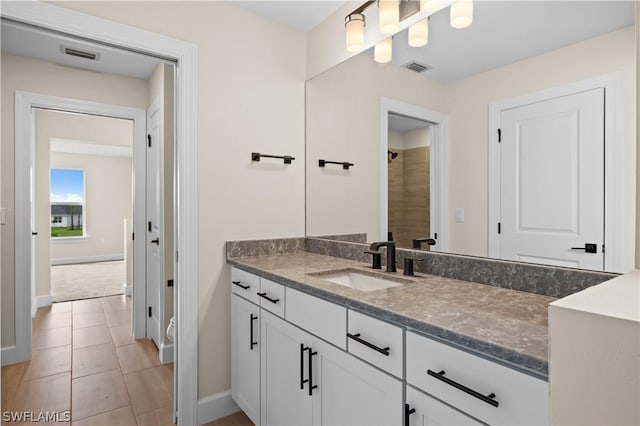 bathroom with vanity and tile patterned floors