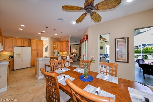 dining area featuring light tile patterned flooring and ceiling fan