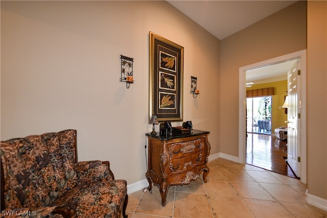 sitting room with light tile patterned floors