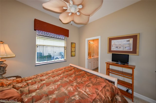 bedroom with carpet floors, ensuite bath, and ceiling fan