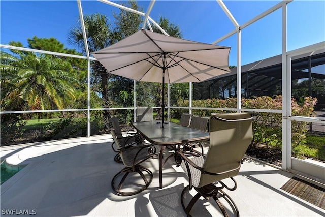 view of patio with a lanai