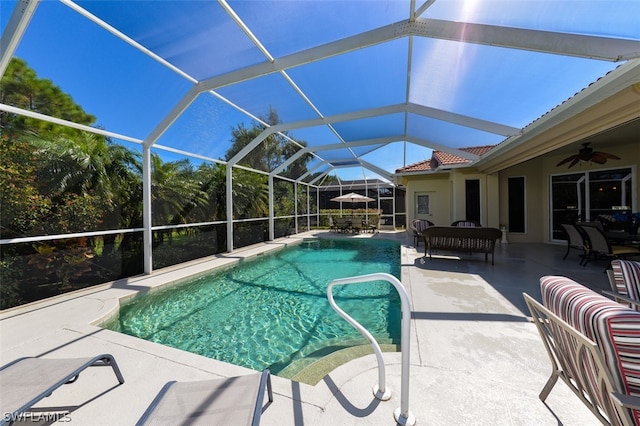 view of pool featuring ceiling fan, an outdoor living space, glass enclosure, and a patio area