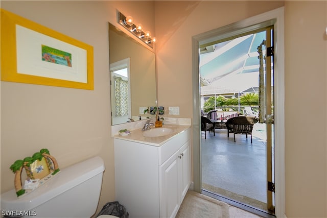 bathroom featuring vanity and toilet