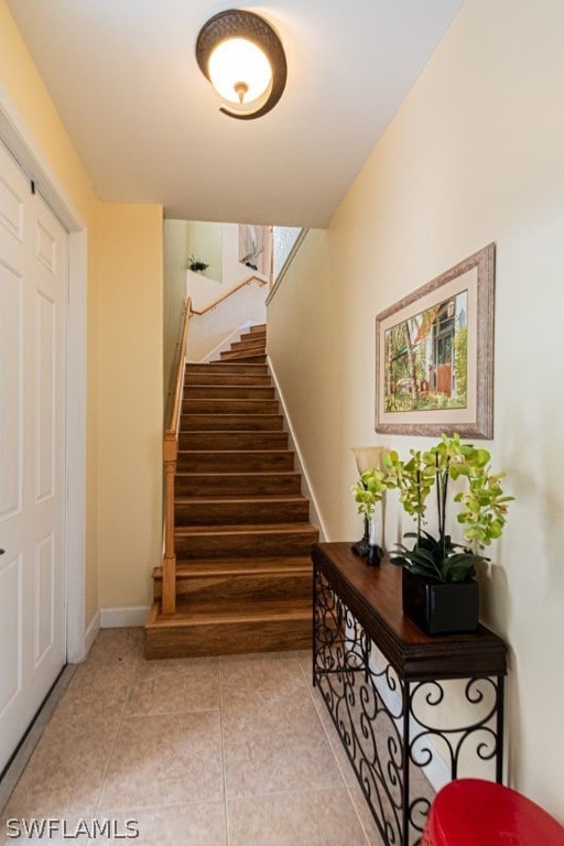 stairs with tile patterned floors