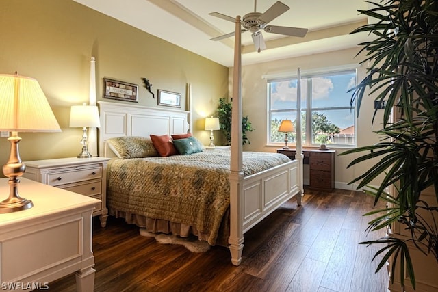 bedroom featuring dark hardwood / wood-style flooring and ceiling fan