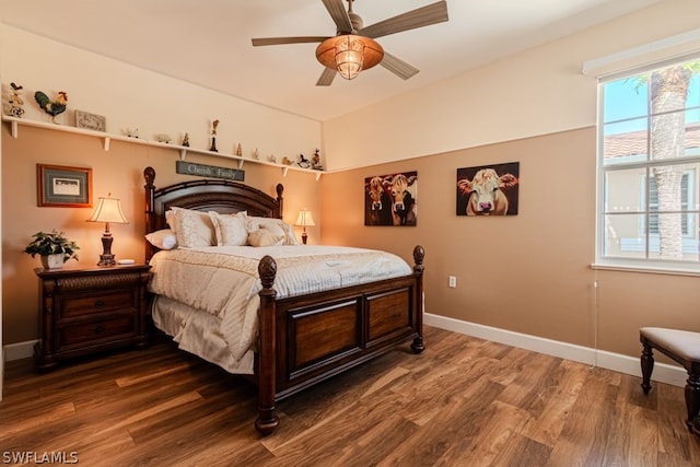 bedroom with ceiling fan and hardwood / wood-style floors