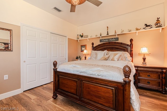 bedroom featuring vaulted ceiling, ceiling fan, a closet, and light hardwood / wood-style floors