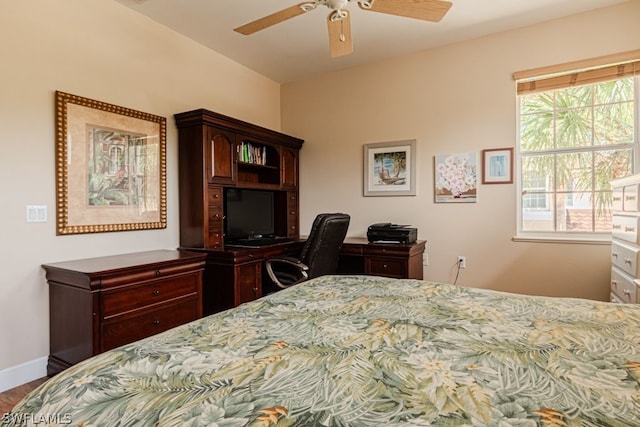 bedroom with multiple windows and ceiling fan