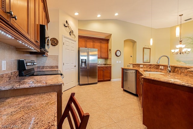 kitchen featuring sink, appliances with stainless steel finishes, light stone countertops, and light tile patterned floors