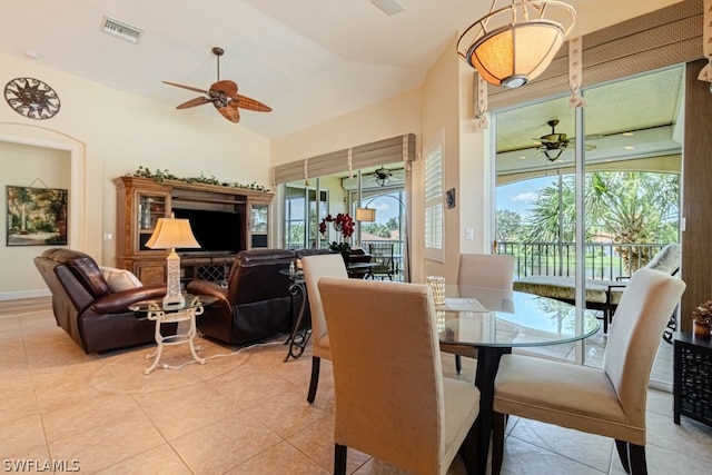 tiled dining area featuring plenty of natural light, vaulted ceiling, and ceiling fan