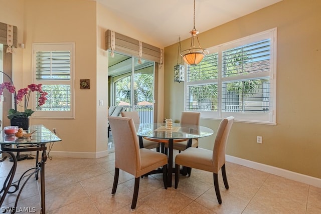 dining area featuring light tile patterned floors