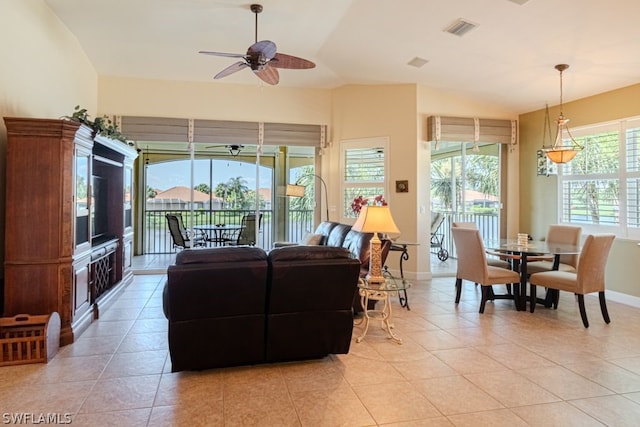 tiled living room featuring ceiling fan