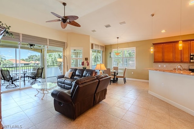 living room with light tile patterned floors and ceiling fan