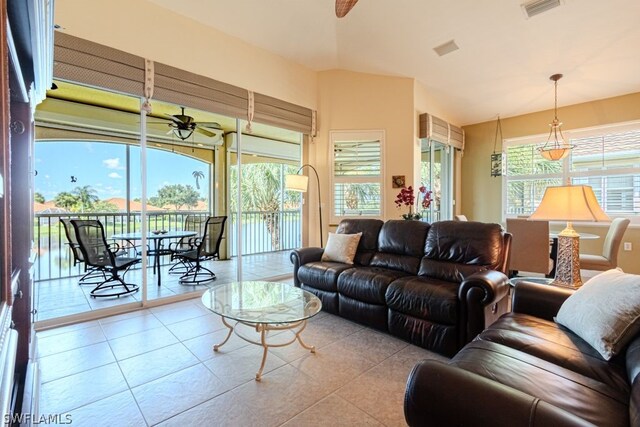 tiled living room featuring ceiling fan