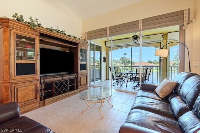 tiled living room with high vaulted ceiling and ceiling fan