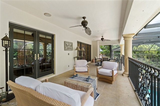 balcony featuring outdoor lounge area, ceiling fan, and french doors