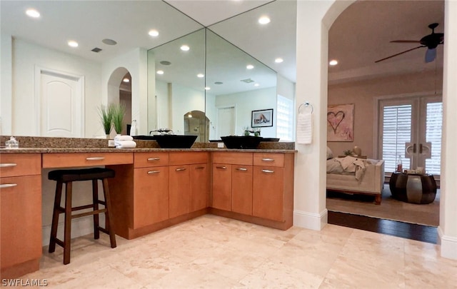 bathroom with vanity and ceiling fan