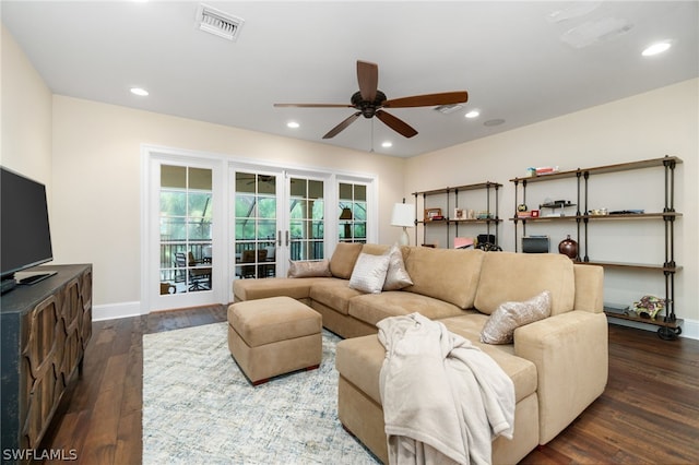 living room featuring ceiling fan, dark hardwood / wood-style flooring, and french doors