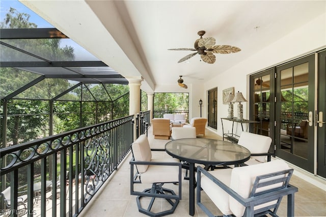 balcony featuring ceiling fan and french doors