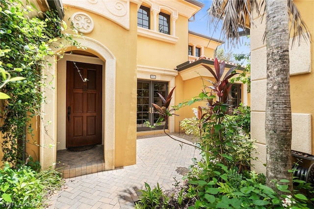 doorway to property featuring a patio area