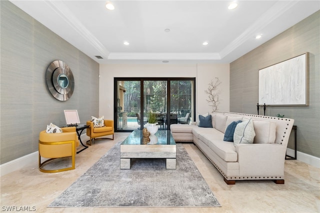 living room featuring ornamental molding and a tray ceiling