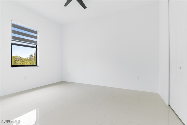 spare room with ceiling fan