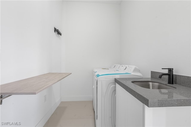 laundry area with sink and independent washer and dryer