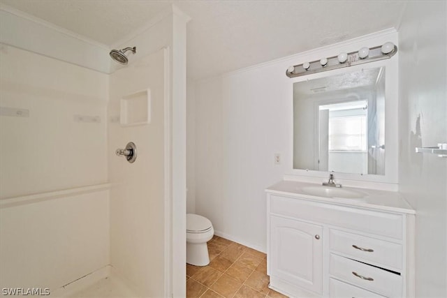 bathroom featuring toilet, vanity, a shower, and ornamental molding