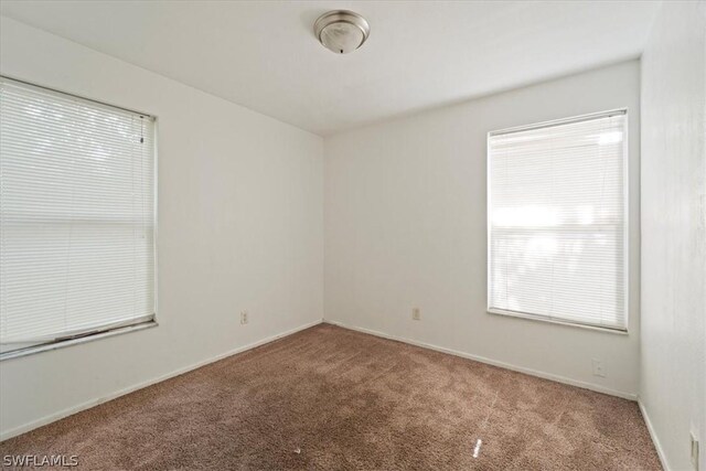 unfurnished room with carpet