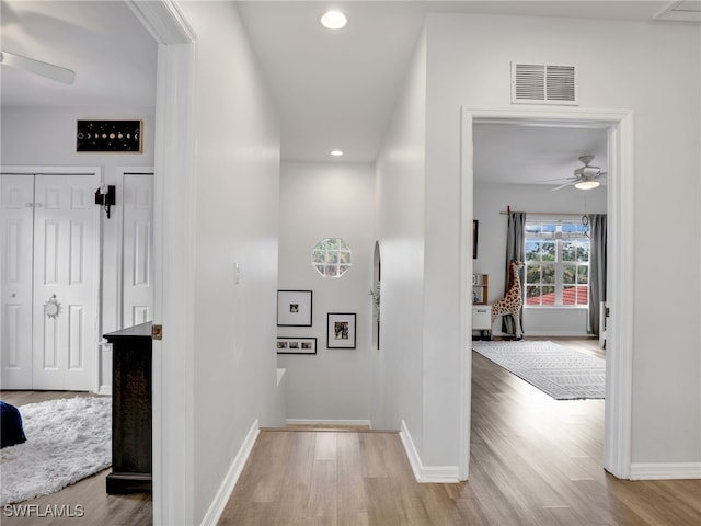 corridor featuring hardwood / wood-style flooring