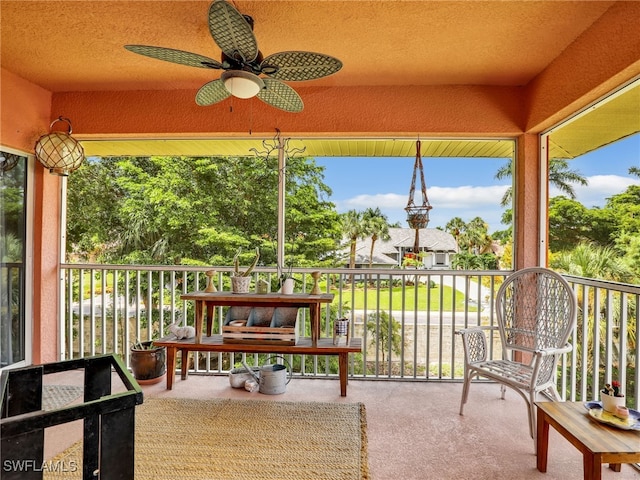 sunroom / solarium with ceiling fan