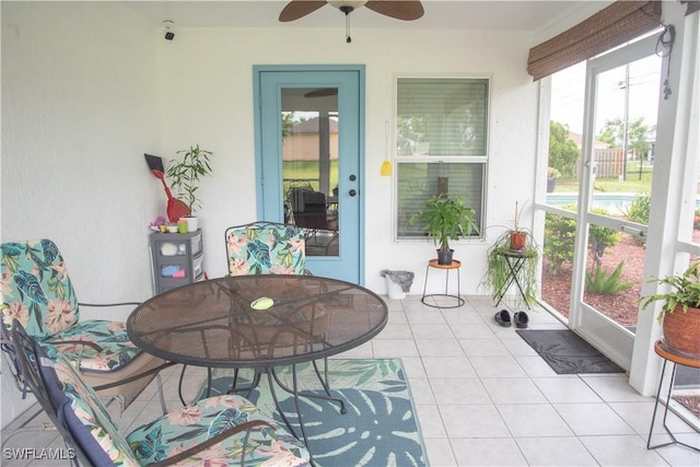 sunroom featuring ceiling fan